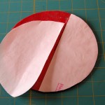 Fusible backing applied to back of appliqued red sample