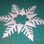 Cut out freezer paper pattern for snowflake