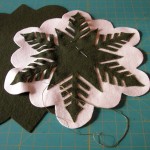 Partially done appliqued green snowflake top