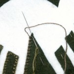 The 'tip' stitch - note the needle is OVER the thread