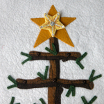 Tree top with 'bright star' ornament buttoned  on!