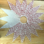 partially done center star for Christmas tree skirt